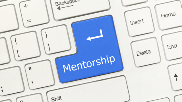 Picture of keyboard with the word mentorship on the return key to illustrate how financial independence in real estate investing required mentorship