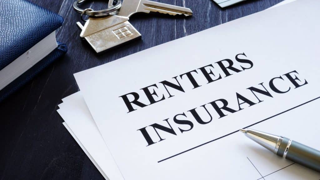 A document labeled 'Renters Insurance' with a pen and a set of keys, representing the benefits of renters insurance for tenants and landlords.